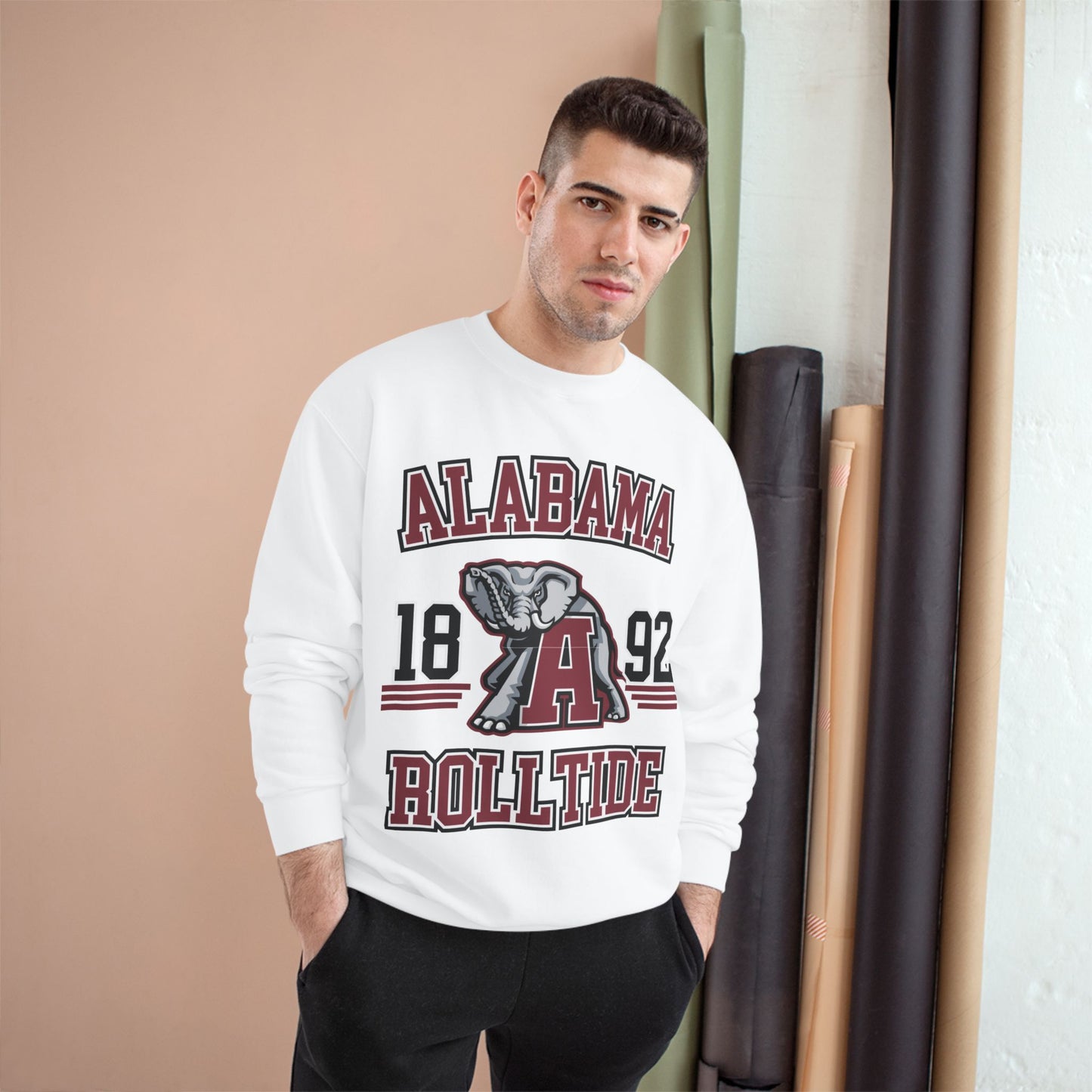 Man wearing a white sweatshirt with 'Alabama Roll Tide' text and logo.