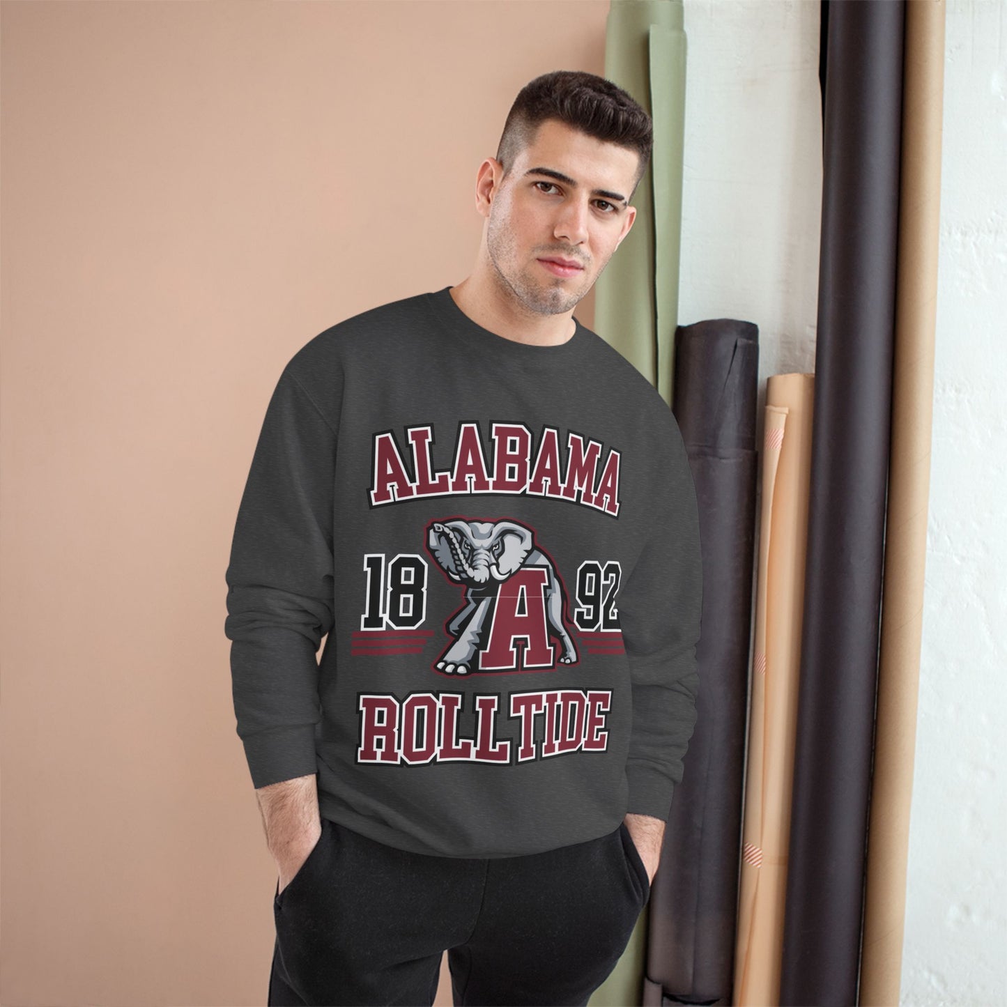 Man wearing a black sweatshirt with 'Alabama 1892 Roll Tide' text and logo.