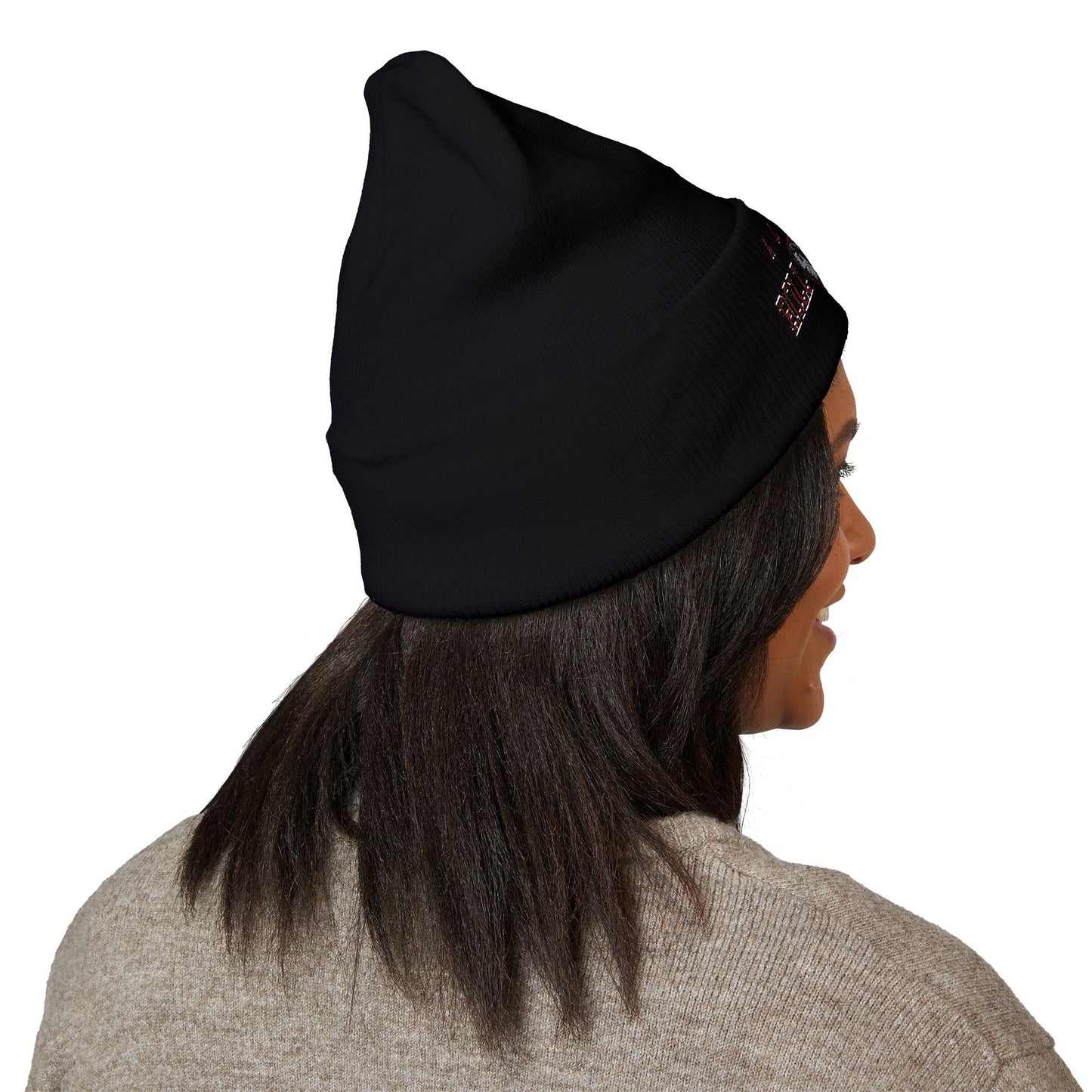 Person wearing a black beanie with a alabama roll tide brand logo on a white background