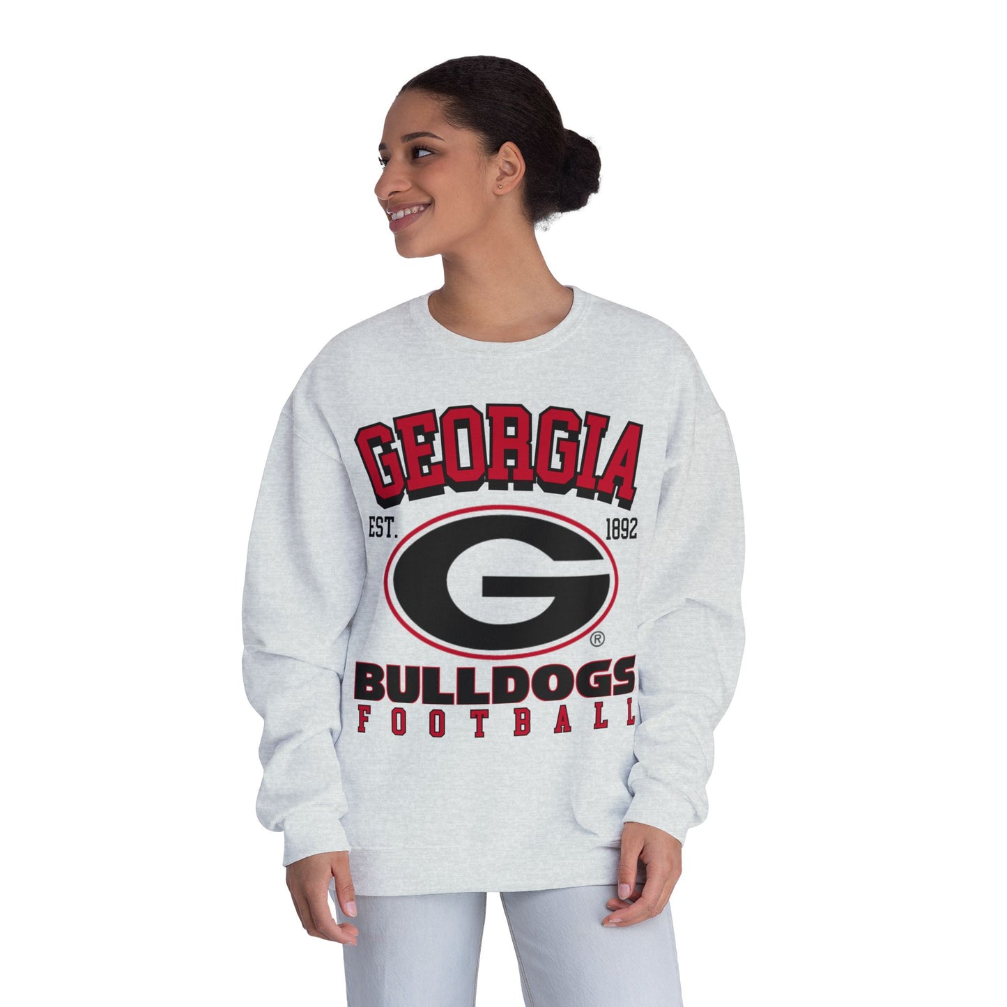 Woman wearing a white 'Georgia Bulldogs' sweatshirt on a white background