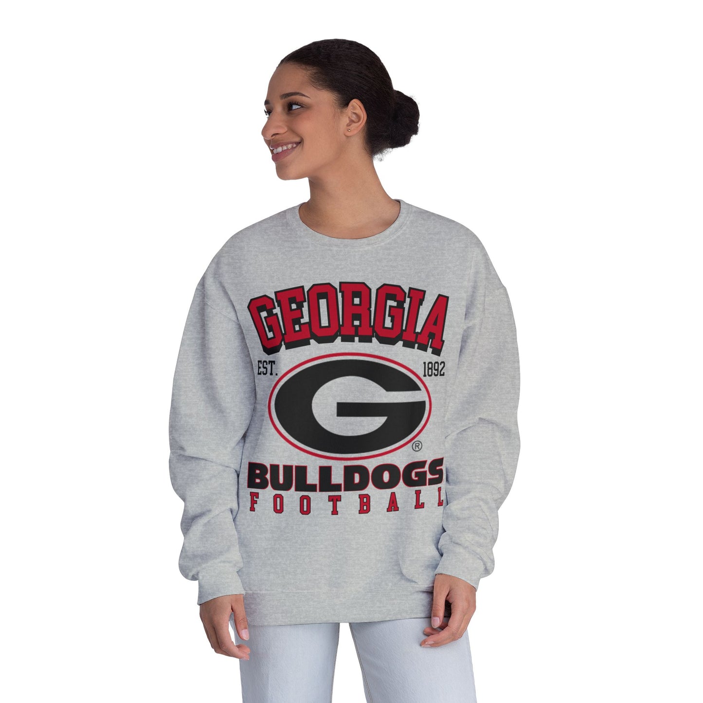Woman wearing a gray 'Georgia Bulldogs' sweatshirt on a white background