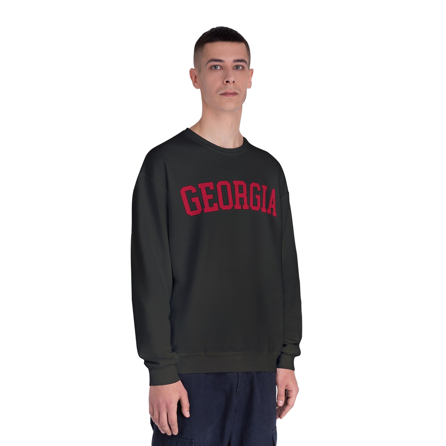 Person wearing a black sweatshirt with 'GEORGIA' printed in red on a white background