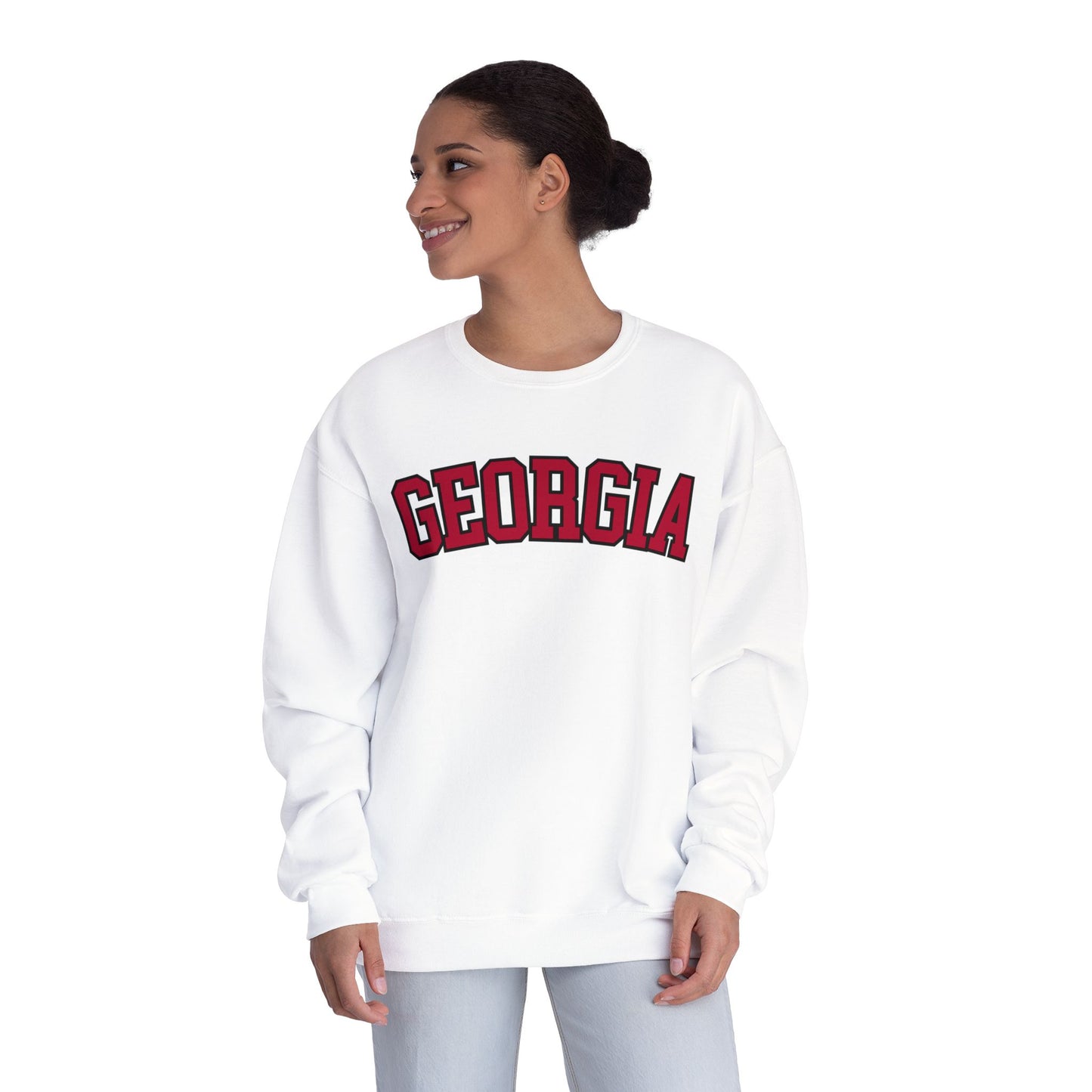 Woman wearing a white sweatshirt with 'Georgia' printed on it against a white background