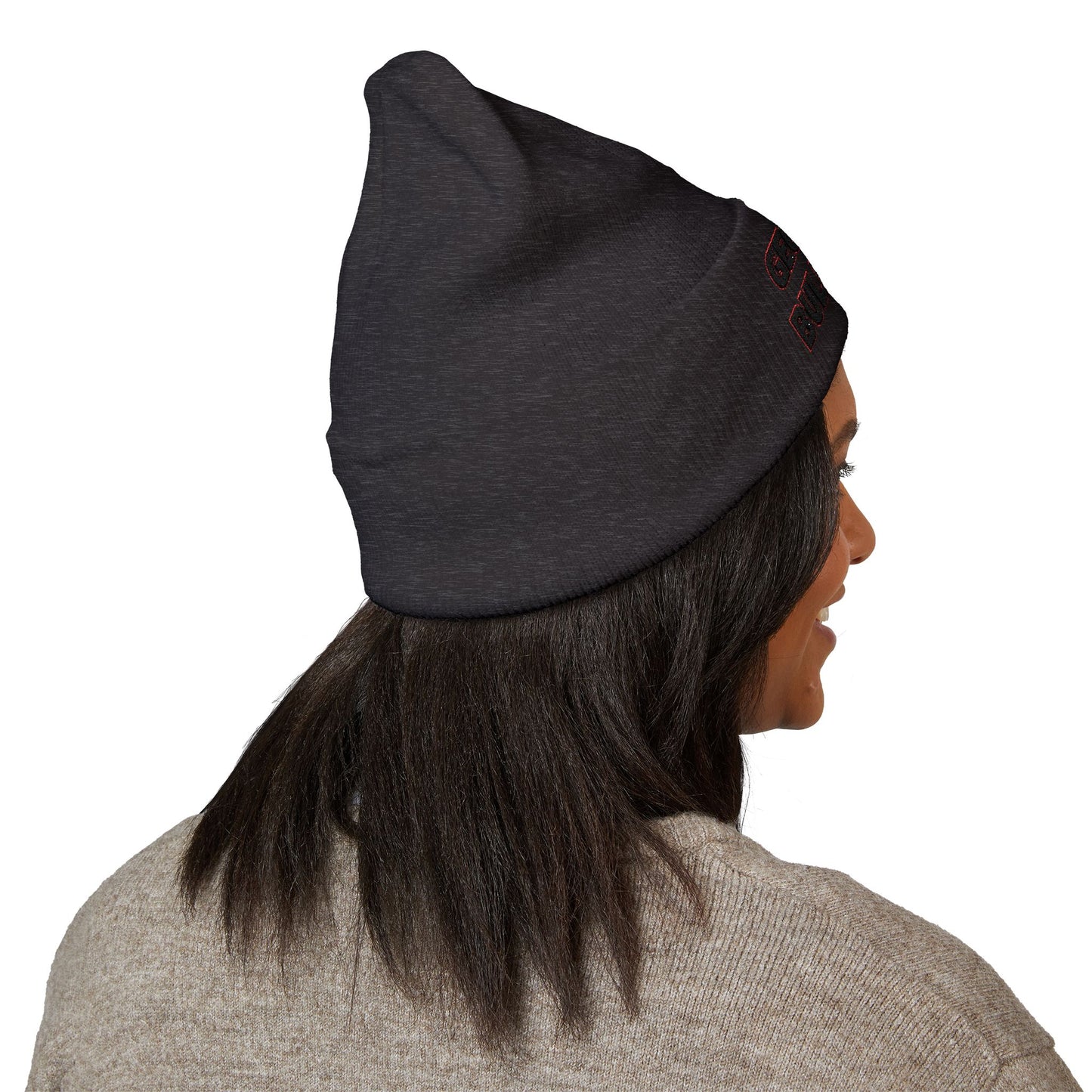 Person wearing a dark graygeorgia bulldogs beanie on a white background