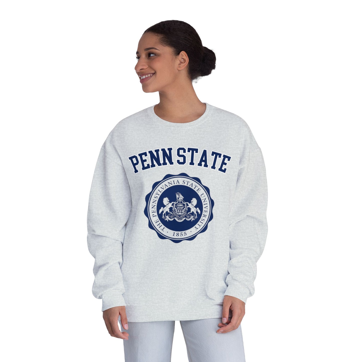 Woman wearing a gray 'Penn State' sweatshirt with a blue emblem on a white background