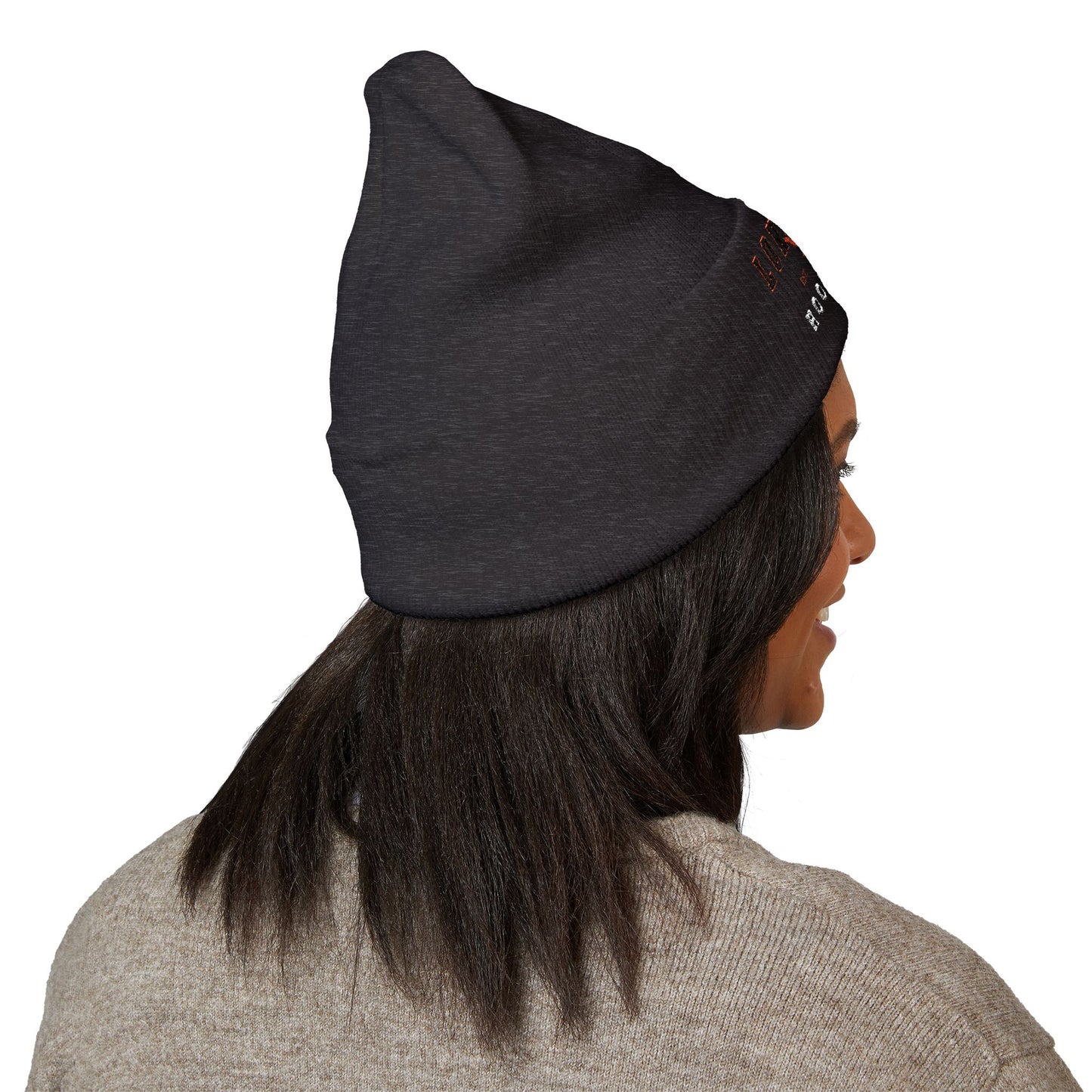 Person wearing a dark gray beanie on a white background with texas long horns hook em logo