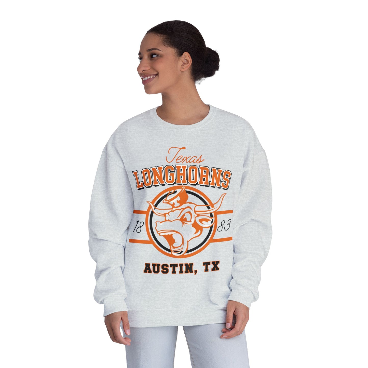 Woman wearing a gray sweatshirt with 'Texas Longhorns' and 'Austin, TX' print on a white background
