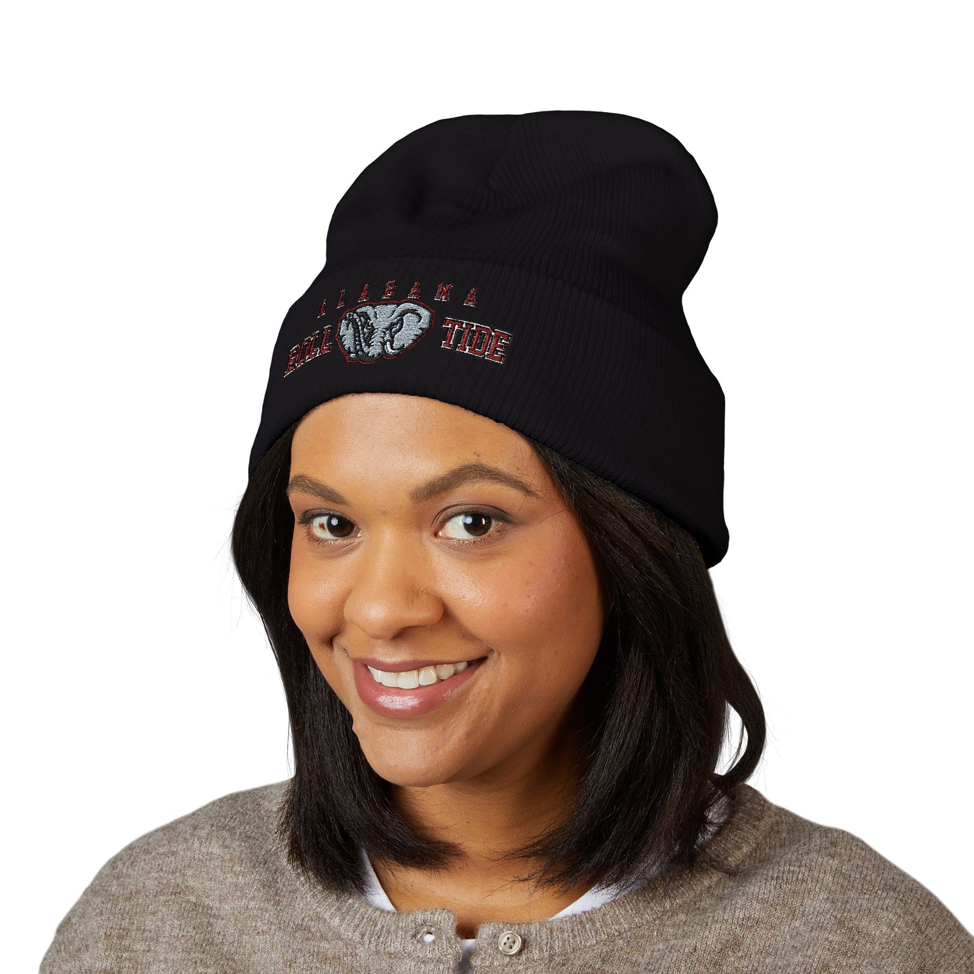 Person wearing a black beanie with a alabama roll tide logo on a white background