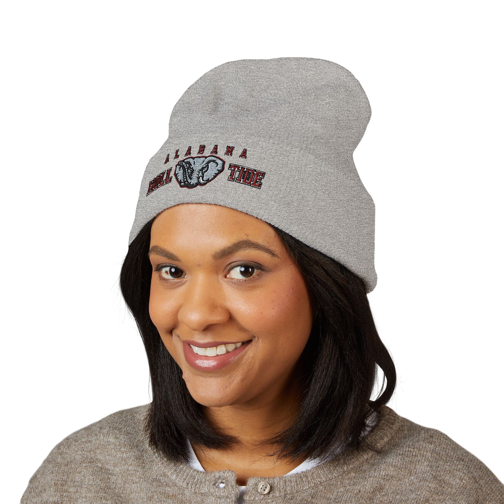Person wearing a gray beanie with 'Alabama' and 'Roll Tide' text on a white background