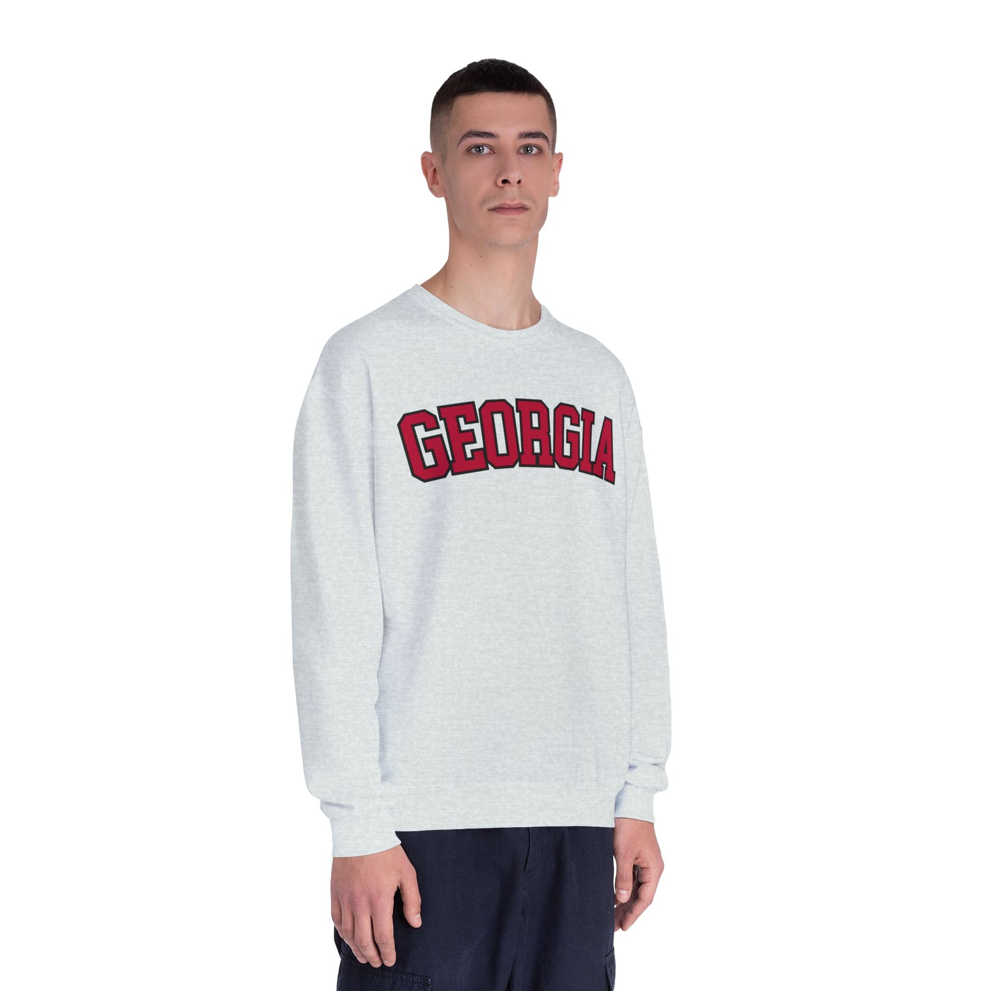 Person wearing a white sweatshirt with 'Georgia' printed in red on a white background