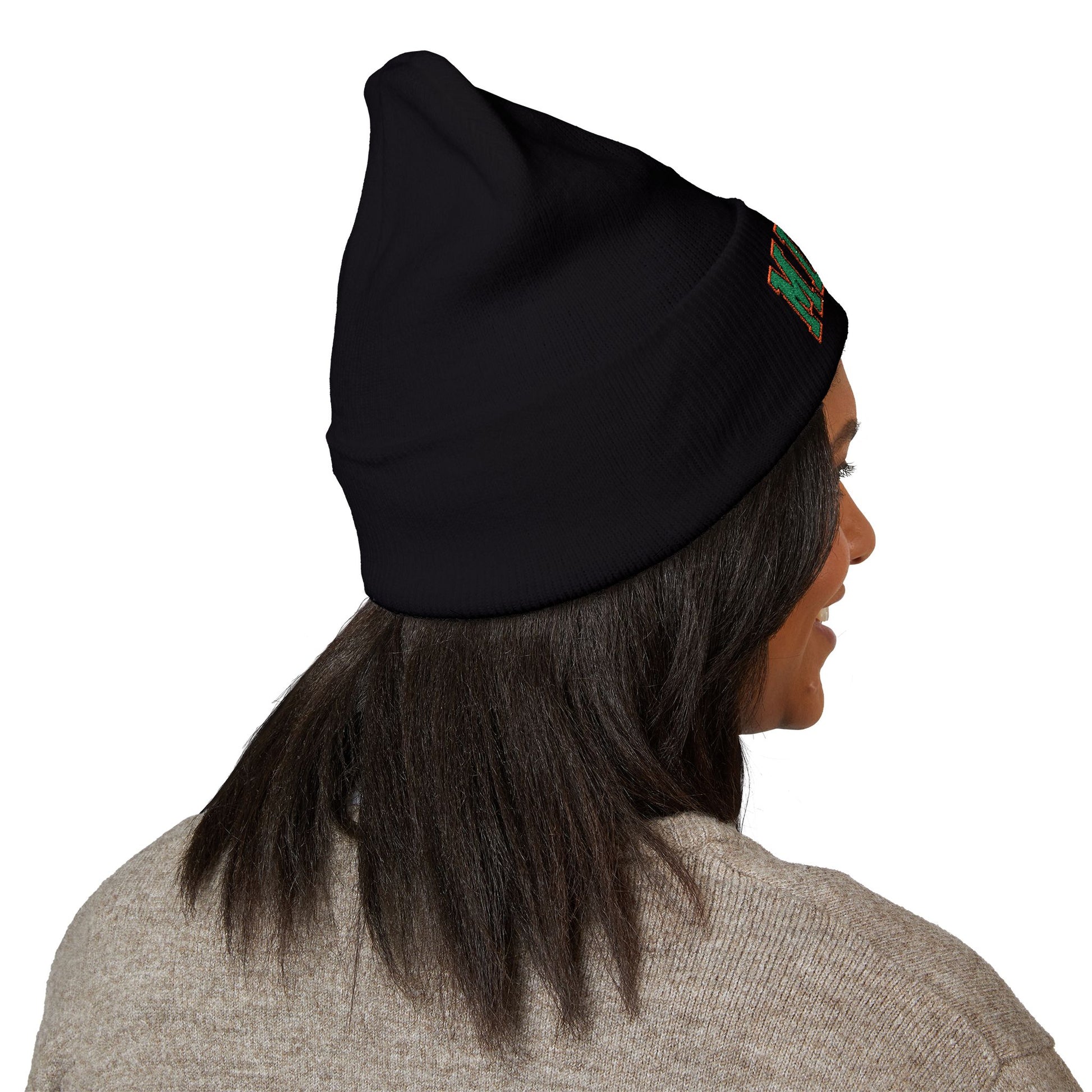 Person wearing a black beanie with a logo on a white background with miami logo on it